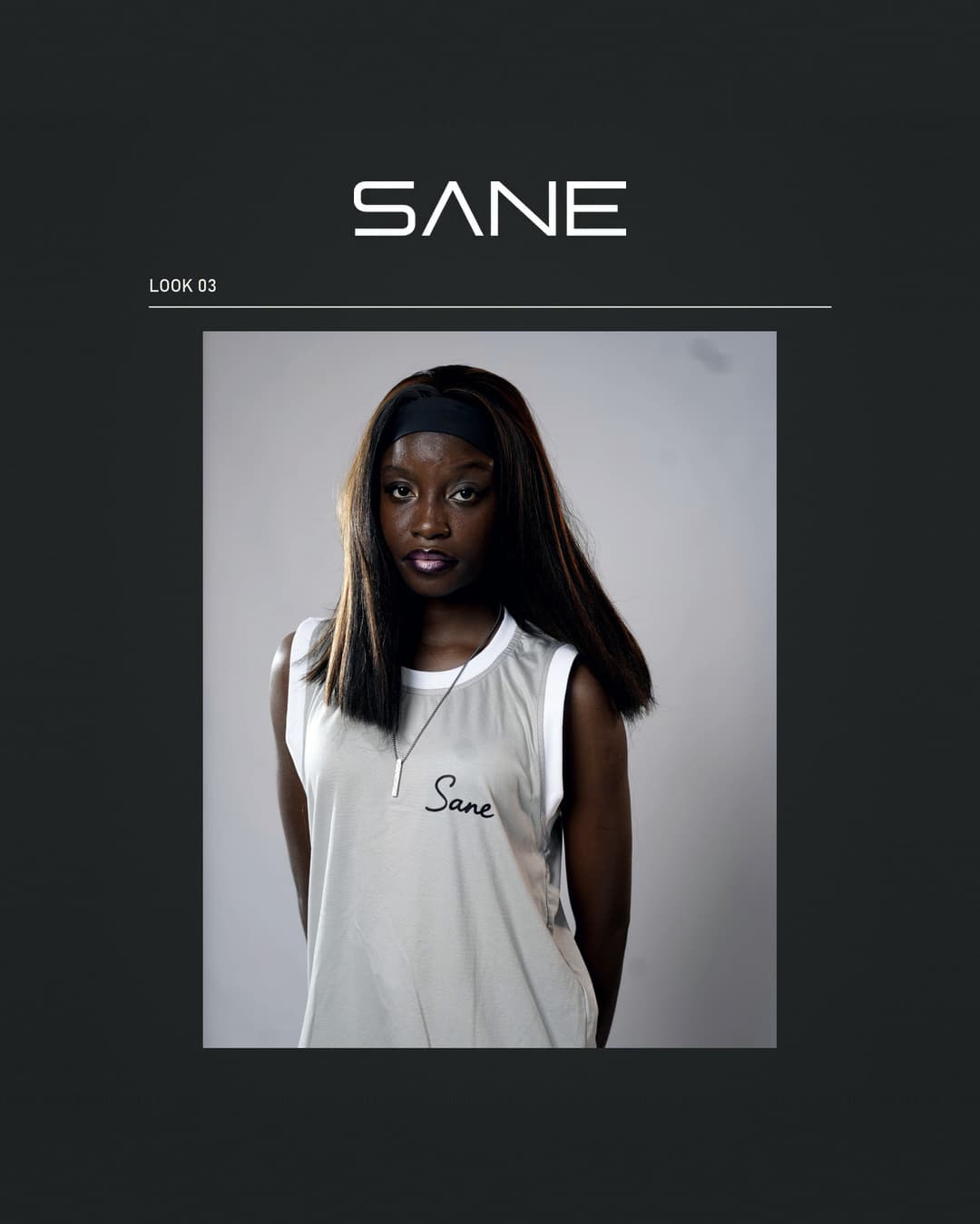 Model wearing a white SANE script tank top