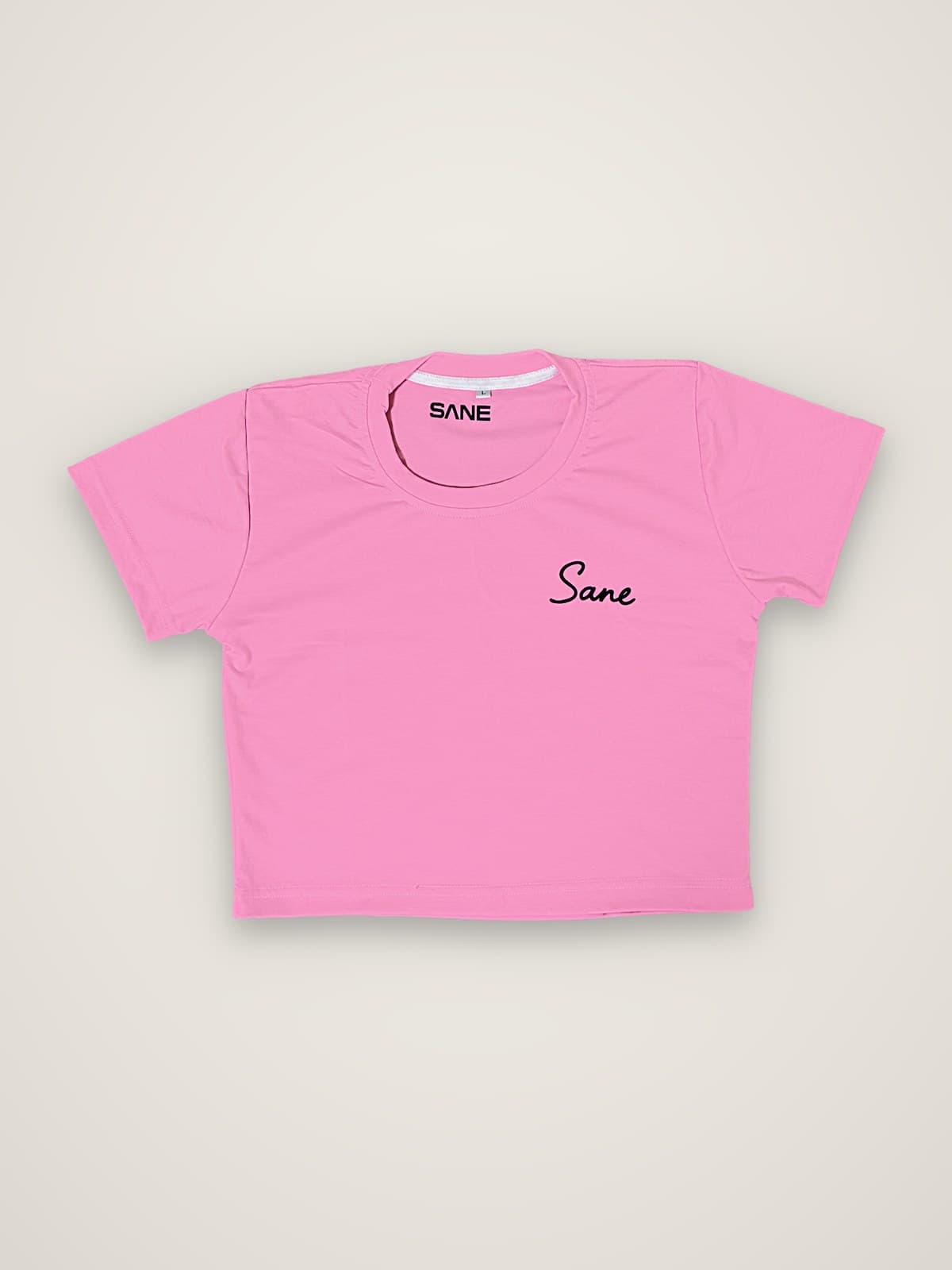 Sane Crop Top in pink with black Sane script