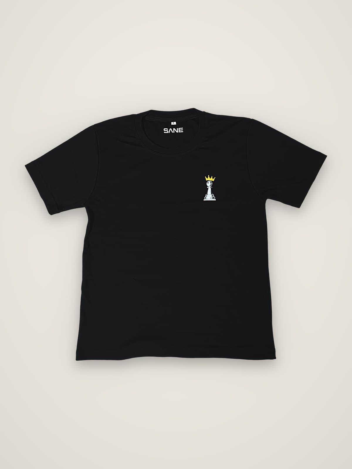The Crown Tee in black, showing the crowned pawn chest print