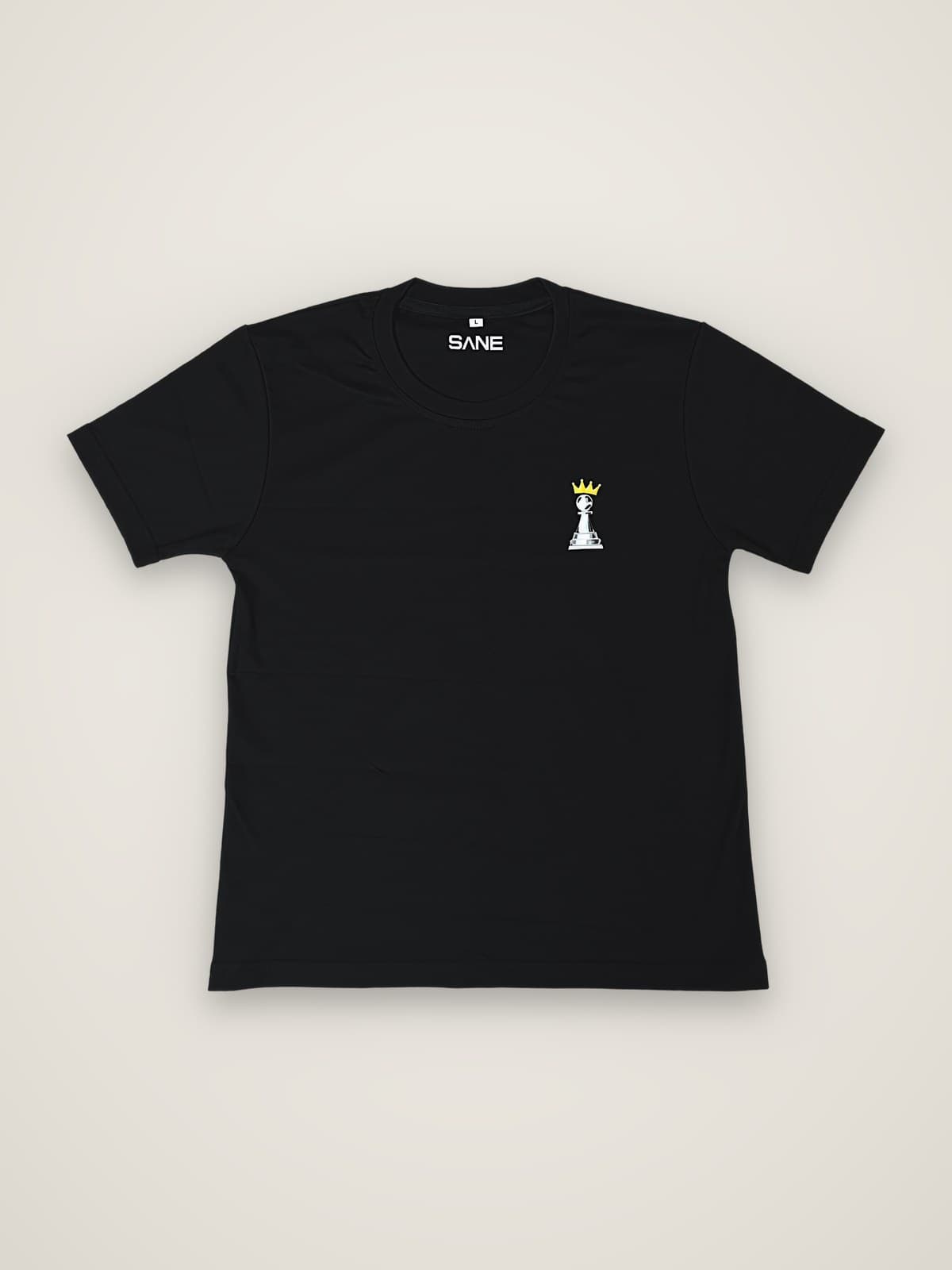 The Plot Tee in black, front view with crowned pawn chest print