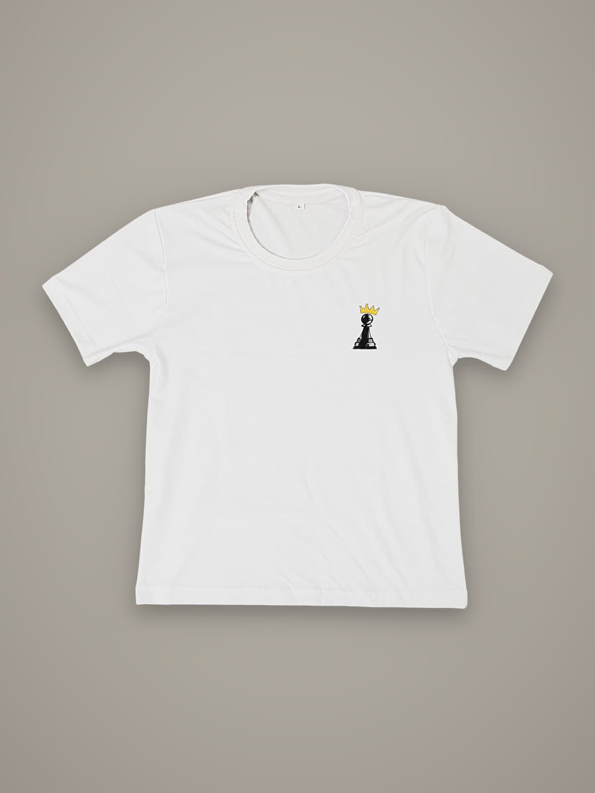 The Crown Tee in white, front view with black crowned pawn chest print